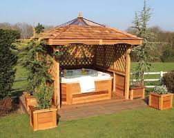 The surround keeps your hot tub secure and it makes the space look even nicer. 32 Beautiful Outdoor Hot Tub Privacy Ideas Hot Tub Gazebo Hot Tub Outdoor Hot Tub Landscaping