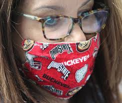 You don't need to wear a face mask outdoors to prevent coronavirus. But  experts say to carry one with you