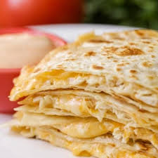 Build the quesadillas by laying a good amount of grated cheese on the bottom tortilla, and then arranging the chicken and cooked peppers on the cheese. Family Favorite Chicken Quesadillas Video Lil Luna