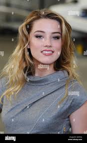 Amber Heard, star of new film Drive Angry 3D, is seen with a Dodge Charger  before she becomes the Star In A Reasonably Priced Car