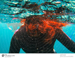 Added by underwatershow.com 2265 days. With Red Hair In Blue Water A Royalty Free Stock Photo From Photocase