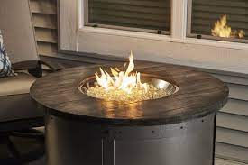 They provide warmth on cool evenings, but can also act as centerpieces during social gatherings. Edison Round Gas Fire Pit Table The Outdoor Greatroom Company