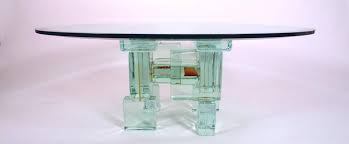 It's built of 4 rectangular block legs joined with a thick stretcher which can serve as a shelf. Glass Block Coffee Table At 1stdibs