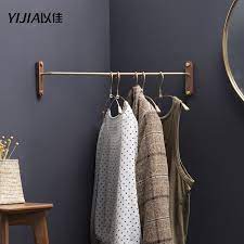 Compact in size, this garment rack makes up for small size with versatile storage. Solid Wood Hanger Wall Hanging Bedroom Corner Rack Simple Clothes Rack Brass Hanging Rod Hangers Racks Aliexpress