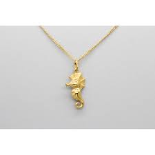 Look for classic, timeless designs that never go out of style like gold chains and pendant necklaces. 18kt Yellow Gold Seahorse Pendant And Charm