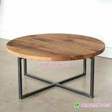 A coffee table is a low table designed to be placed in a sitting area for convenient support of beverages, remote controls, magazines, books (especially large, illustrated coffee table books), decorative objects, and other small items. Coffee Table Industrial Bulat Indomebel Id