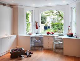 The configuration of your bay window will separated bay windows usually have thick sections of wall between each window that pushes the. Plastic Acrylic Armchairs With City And Country Home Office Modern And Double Desk 2 Jpg 990 754 Window Desk Built In Desk Desk Design