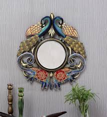 Peacock mirror over traditional fireplace with dentil molding, brick surround and herringbone firebox accented with turquoise foo dogs, recycled glass vase and brass double sconce. Buy Mnago Wood Abstract Wall Mirror In Blue Colour By D Dass Online Decorative Mirrors Wall Accents Home Decor Pepperfry Product