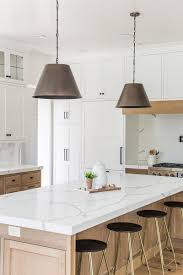 Gunmetal Finish On The Pendants Over The Large Kitchen Island With Quartz White Counteretops Millhaven H Light Wood Kitchens Wood Kitchen Island Wood Kitchen
