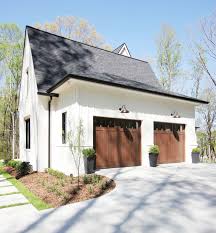 In this video, i show you how i took our boring, steel garage door and turned it into a wood door using paint and stain. Things To Consider Before Purchasing Garage Doors For Your Home Plank And Pillow