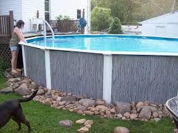 River Rocks Around Our Pool Landscaping Around Pool Above Ground Pool Landscaping Backyard Pool Landscaping