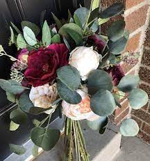 With a silk flower bouquet you will create a keepsake to remember your wedding day for years to come. Plum And Ruby Eucalyptus Bridal Bouquet Winter Wedding Red Roses Peony Silk Flower Bou Bridal Bouquet Flowers Silk Flower Bridal Bouquet Bridal Bouquet