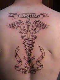 Let me know what you think rate 1000s of pictures of tattoos, submit your own tattoo 6 Medical Symbol Upper Back Tattoos