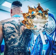 The brazilian has an amazing tattoo of a rose and a skull under his right ear which surrounds his adam's. Ederson Back Tattoo