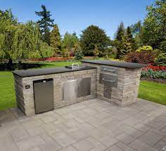 Custom outdoor kitchens can consist of wine chillers, under counter refrigerators, pizza ovens, wet bars, fireplaces, side burners, smokers, warming drawers and even roasting spits. Outdoor Custom Built In Kitchen Islands Stone Granite Veneer