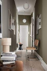 A Scandinavian Apartment With Olive Green Walls The Nordroom In 2021 Scandinavian Apartment Olive Green Walls House Flooring
