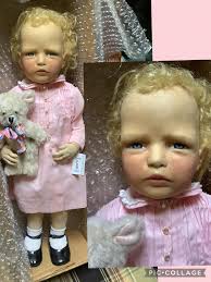 Where could she be from? She has something inside and makes noise being  like a musical/rhytmic instrument. She seems to be made of some sort of  inside empty wood or fruit.