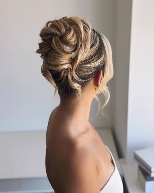 Sophisticated Blonde Twisted Updo with Soft Face-Framing Curls