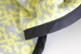When you examine the bias tape you'll see that one folded side is slightly wider than the other. Easy Fleece Bias Tape Blanket Tutorial With Rounded Corners See Kate Sew