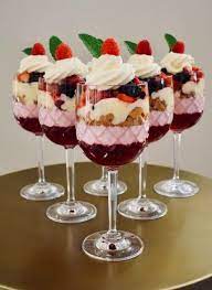 Creamy no bake white chocolate lemon cheesecake tarts, topped with your favorite fresh fruit, mint, and a dusting of powdered sugar. Mini Trifles Delicious Christmas Desserts Xmas Food Christmas Cooking