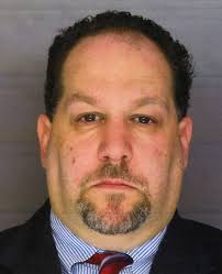 Athletic director arrested