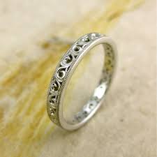 Traditionally, wedding bands and engagement rings are made of the same metal, so many people assume a contoured wedding band is designed to match the curvature of your engagement ring. Handmade Floral Patterned Wedding Ring In 14k White Gold With Scrolls And Mil Grain Detailing On Edges Size 5 Wedding Rings Jewelry Beautiful Jewelry