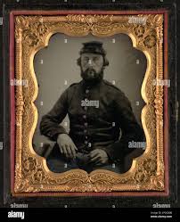 Saddler Albert Walker Simmons of Co. H, 75th New York Infantry Regiment in  uniform. Liljenquist Family Collection of Civil War Photographs ,  FAmbrotype/Tintype photograph filing series , pp/liljunion. Simmons, Albert  Walker, 1827-1901,