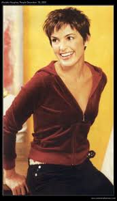 Her chin length cut is styled up and back to reveal her sexy neckline. Mariska Hargitay Image