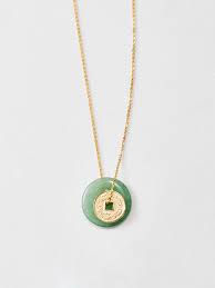 Featured jewelry from the 14k gold jade pendant of chinese zodiac. Jade Coin Necklace X Fong Min Liao Loren Stewart