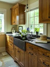 Rustic Wooden Cabinets With A Dark Apron Sink Rustic Kitchen Cabinets Kitchen Cabinet Design Rustic Kitchen