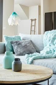 Mint And Grey Faux Fur Cushions On Grey Sofa With Mint And White Paper Pendant Light Living Room Turquoise Living Room Grey Mint Living Rooms