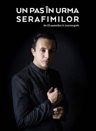 Inițial încearcă să se adapteze mediului, dar în cele din urmă își dă seama că sistemul este complet corupt și abuziv; One Step Behind The Seraphim 2017 Photo Gallery Imdb