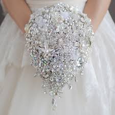 Keep your artificial wedding flowers forever, reuse them in your home decor, and forget about allergies. Big Promo Luxurious Wedding Accessories Brooch Bouquet Ivory Gray Crystal Wedding Bouquet Silk Wedding Flowers Bridal Bouquets Diy Decor