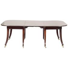An English Regency Early 19th Century Mahogany Dining Table Having Reeded Edge With Rounded Rectangular Top And Saber Mahogany Dining Table Dining Table Table