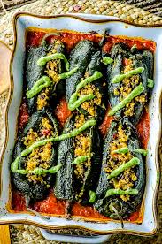 My husband and i teamed up to create this stuffed poblano peppers recipe, which is one of our favorites. Stuffed Poblano Peppers With Avocado Cilantro Sauce May I Have That Recipe
