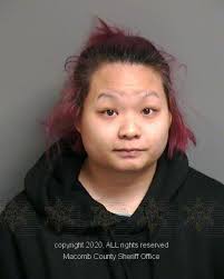 Woman admits to firing shot at father of ex-boyfriend in ...