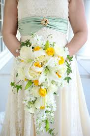 Pin By Apple Blossoms Floral Designs On Bridal Bouquets Yellow Bridal Bouquets Cascading Wedding Bouquets Lily Bouquet Wedding