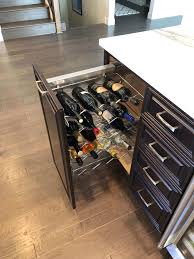 Leather strap and metal hanging post. Valley Custom Cabinets Custom Bars