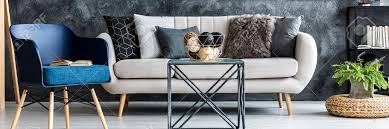 Throw pillow cover navy stone coral white pillow cover couch cushion decor home decor living room pillow elephant items similar to decorative throw pillow cover. Light Grey Sofa With Decorative Pillows Standing In Dark Living Room Interior With Metal Table Fresh Plant And Blue Armchair With Book Stock Photo Picture And Royalty Free Image Image 102848238