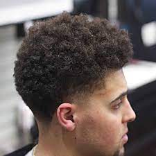 A great way to tame an afro, remove the hair from the face, while also finding a perfect curly hairstyle for boys is creating this high top long afro ponytail. 35 Best Curly Hair Haircuts Hairstyles For Men 2021 Update