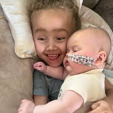 Tobin loves her baby sister so much! Adley wasn't so sure about it. Tobins  face in the last one is her saying umm I'm done 😅 #tobinstime  #hopeforadley #curecanavan #canavandisease #savingtobingrace