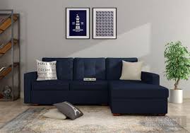 This simple and sleek design of latest l shape sofa design is the perfect choice for the walnut finish on sheesham wood and vibrant colour on upholstery are blended perfectly to form a modish design. Buy Nicolas L Shape Right Aligned Sofa Indigo Ink Online In India Wooden Street In 2020 Wooden Sofa Designs Living Room Sofa Design L Shaped Sofa