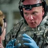 Hospital Corpsman 3rd Class Charles Carroll, from St. Clair Shores, Mich.,  studies in-rate material for the upcoming Navy-wide advancement exam.