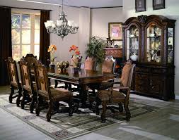 Fifteen lights adorn this stunning light with a burnt bronze finish and gold leaf details. Neo Renaissance Formal Dining Collection My Furniture Place