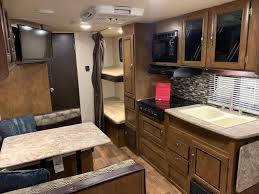 Model 263bhxl offers a double bed set of bunks, two entry/exit doors, and a large slide out. 2017 Forest River X Lite 201bhxl Red 10 Rv