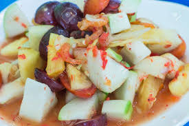 Som tam is a popular thai salad featuring green papaya and a spicy chile pepper dressing. Som Tam Fruit Salad Som Tam Polamai Stock Photo Picture And Royalty Free Image Image 23573554