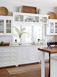 The space above my kitchen cabinets was only 12, from the top of the cabinets to the ceiling. Kitchen Window Dressing Decorating Above Kitchen Cabinets Above Kitchen Cabinets Kitchen Design