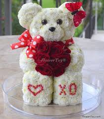 No matter the occassion, 1800flowers® has the gifts and love for you to brighten a day. Flowertoy Xo Teddy Bear Made With Fresh Flowers Animal Flower Arrangements Flower Toy Large Floral Arrangements