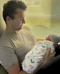 Charlie Kirk Holding his newborn son — a tender moment now turned into a  memory that will be missed forever. 💔🕊️ His love as a father will live on  through his child,