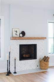 You can use tile to create a backsplash on your fireplace panels, or go all out and tile the whole thing if you want to really make a statement. 25 Tiled Fireplaces To Accent Your Living Room Digsdigs
